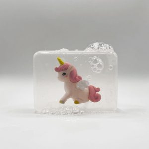 Savon avec figurine licorne rose couchée